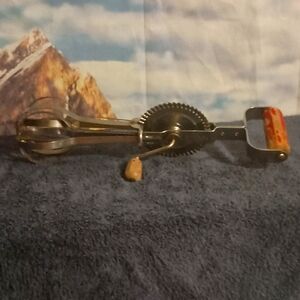 A&J High Speed Hand Held Egg Beater with wood handles. Vintage from around 1940s